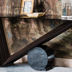 VALENTINO CONSOLE – Geometric, modern and sculptural-like console, with a glass top which enlightens the different materials combination for the base. By Cattelan Italia.