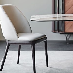 MARIEL DINING CHAIR – Elegant upholstered chair with a wraparound backrest and soft padding for extra comfort. Available with wooden or metal legs. By Cattelan Italia.