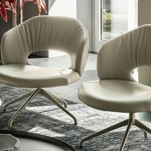 MIRANDA LOUNGE – Contemporary designer chair with a hole in the back to enhance comfort when seated, available in fabric or leather. By Cattelan Italia.
