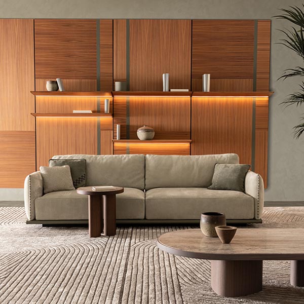 Ulivi living room collection: ZIGLY SOFA – Modern designer sofa featuring a wooden or leather base and a signature detail: the leather string running down the armrests. By Ulivi.